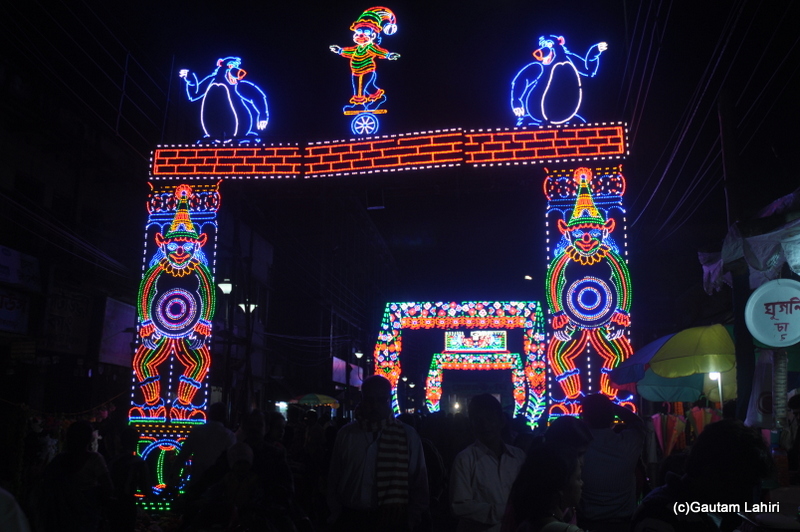 Electric artwork that adorns the streets with about a million people visiting the pandals in Chandannagar by Gautam Lahiri