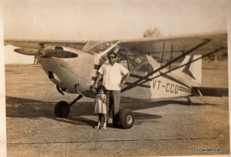 My father with my sister, standing beside the petite PMy father with my sister, standing beside the petite Stinson Sentinel L5 Club, after their maiden flight over the city of Nagpur, after their maiden flight over the city of Nagpur, India by Gautam Lahiri