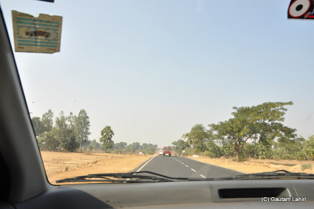 The road in this section was smooth as a silk and the car unlike the dancing session she had was stable and we increased our gallop to cover more distance   at Massanjore, Jharkhand, India by Gautam Lahiri
