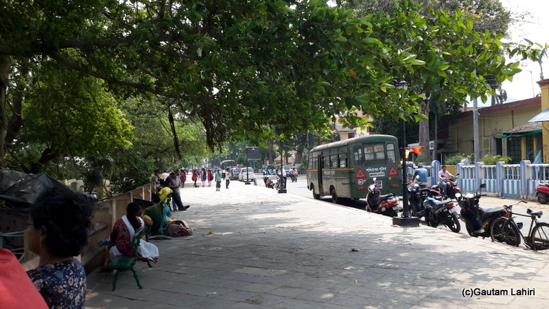 Chandannagar Strand, bustling with activities. Restaurants, old houses, colleges, and people lazily sitting on the iron benches relished the riverside by Gautam Lahiri