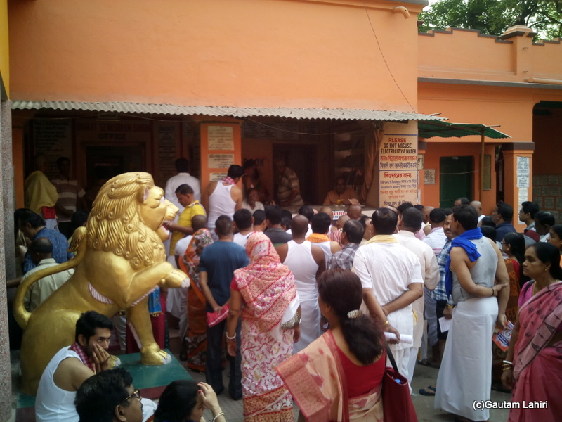 At Gaya, Pilgrims gathered around for getting directions from the BSS officials by Gautam Lahiri