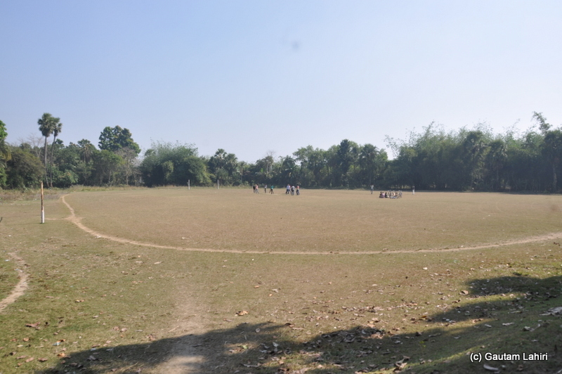 A football or soccer field was preparing itself for a game of soccer as we trundled past it in Purbasthali by Gautam Lahiri