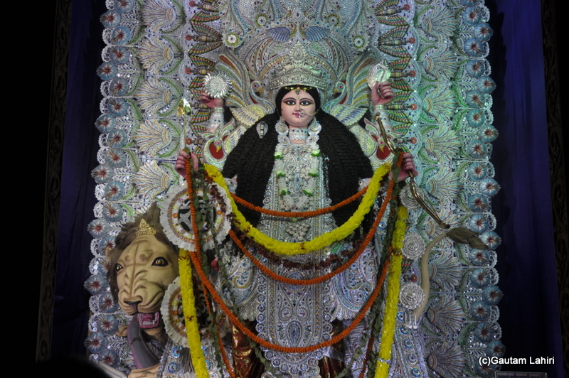 The idol of Jagadhatri, resplendent with all the jewellery, weapons and she sits on a lion in Chandannagar by Gautam Lahiri