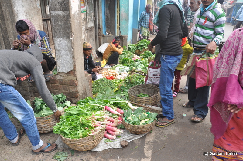 The roads were filled with the local market trying to woo customers at Bosipota by Gautam Lahiri