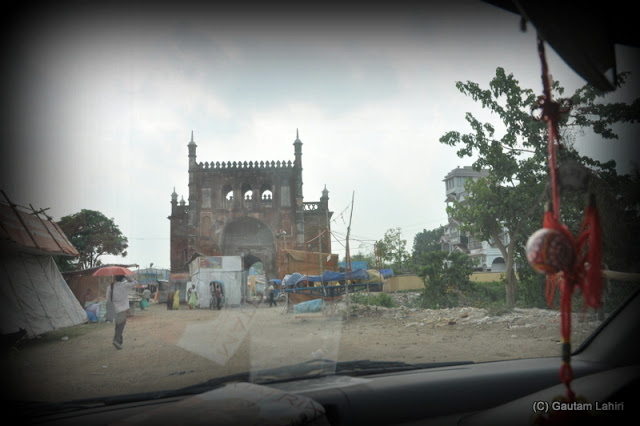 The entrance structure which stands derelict and ravaged by the elements leads a visitor to the main palace  at Krishnanagar, West Bengal, India by Gautam Lahiri