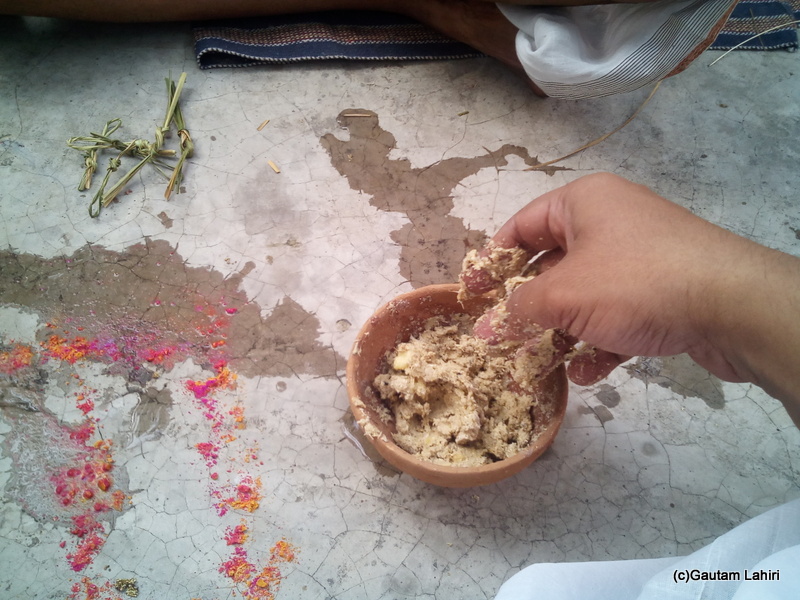 At Gaya, Pinda being made by me as traces of Vermilion are strewn by the priest by Gautam Lahiri