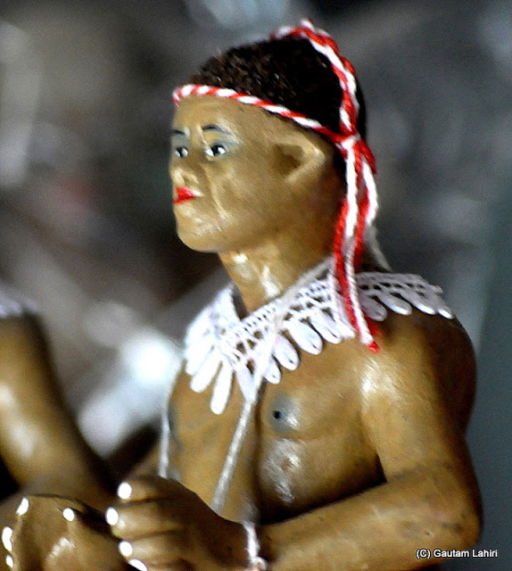 A Jarawa tribal model made of clay with their tribal embellishments and rippling muscles  at Krishnanagar, West Bengal, India by Gautam Lahiri