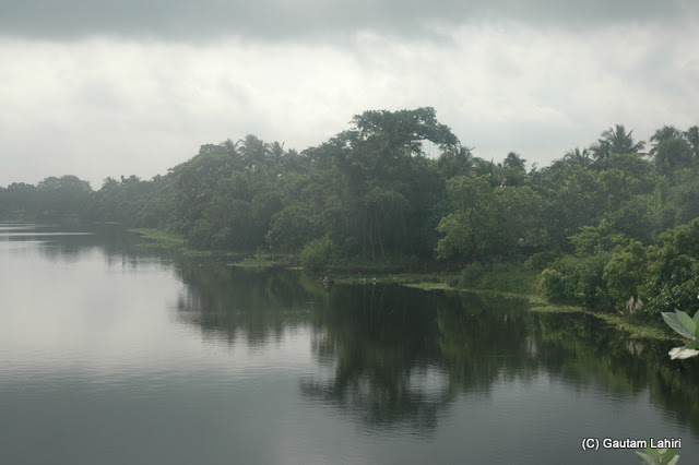 Sun and cloud played a game of light over the Jalangi river at Krishnanagar, West Bengal, India by Gautam Lahiri

