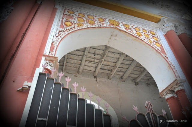 The decoration on the roof and the gate wall which had a huge metal gate with floral design on top at Krishnanagar, West Bengal, India by Gautam Lahiri