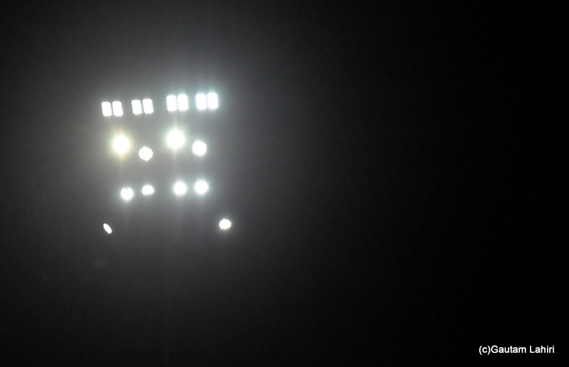 Flood lights of a cricker ground by Gautam Lahiri