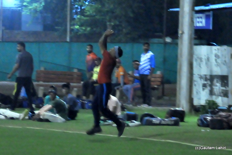 The deep mid wicket fielder catches the ball almost at the boundary in cricket by Gautam Lahiri