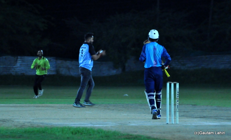 The bowler catches the ball by Gautam Lahiri