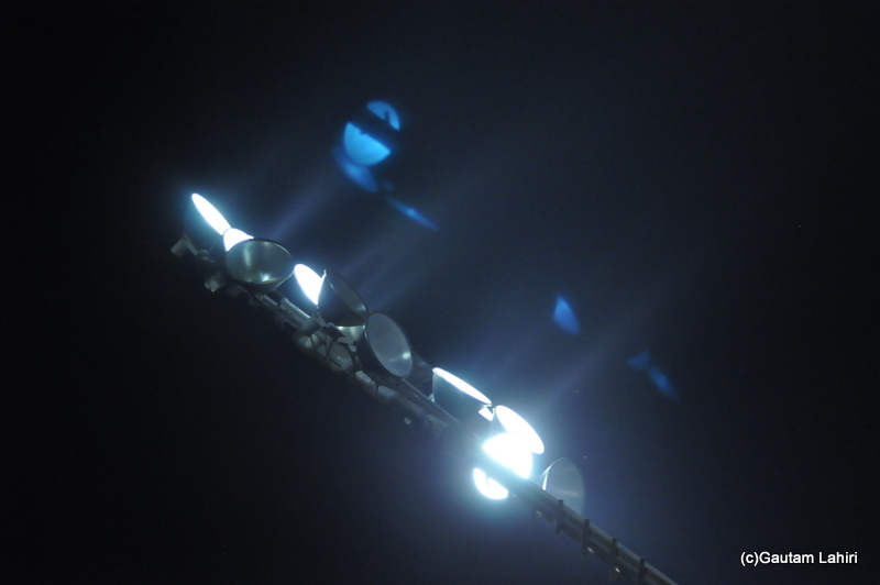 The flood lights on a cricket field by Gautam Lahiri