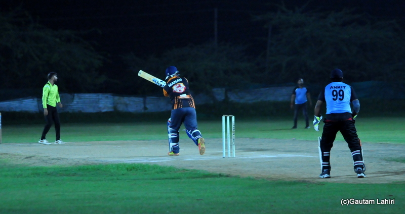A cricket batsman hits four run by Gautam Lahiri