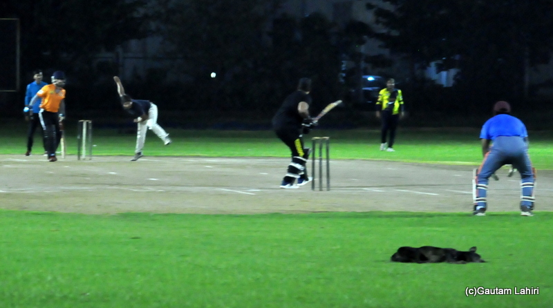 The wicket keeper looks at the fast delivery, ready to grab the ball in case the bat misses in cricket by Gautam Lahiri