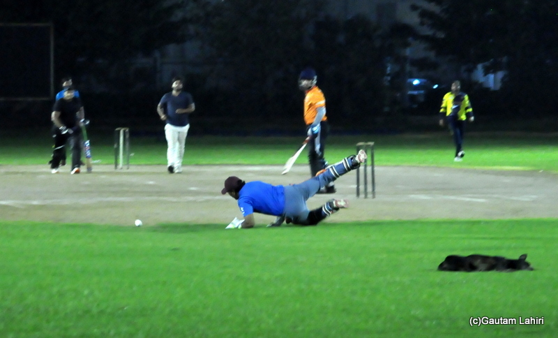 The wicket keeper stops the ball in cricket by Gautam Lahiri