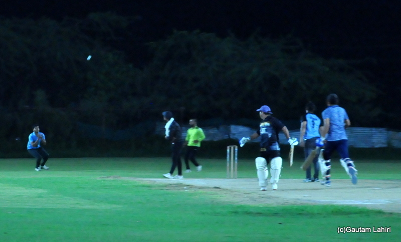 Cricket batsman lifts the ball, as it is about to get caught by Gautam Lahiri