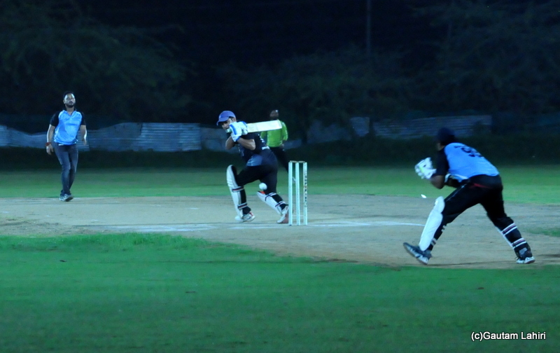 A cricket batsman pulls a shot by Gautam Lahiri