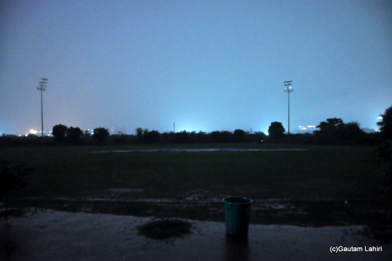 The cricket field aglow with city lights by Gautam Lahiri