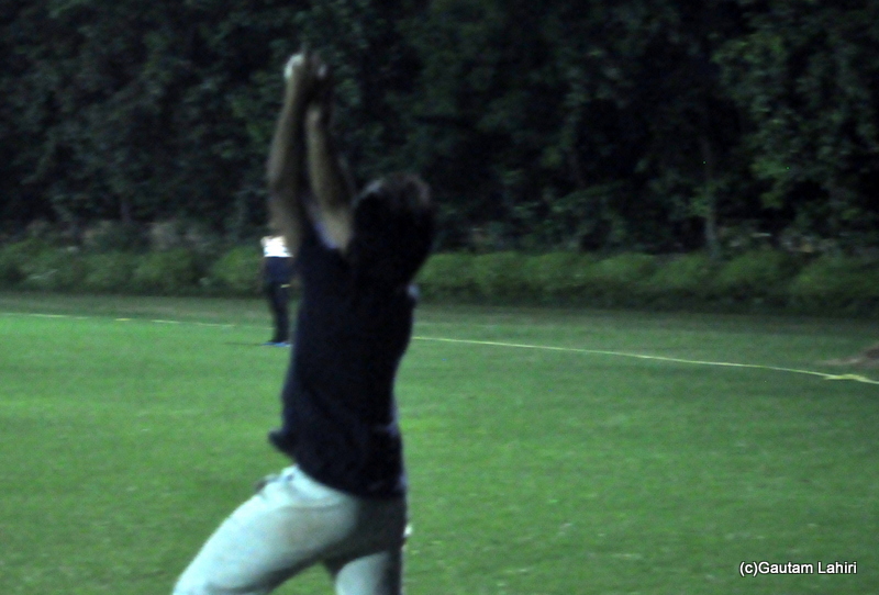 Long on fielder catches the ball in cricket by Gautam Lahiri