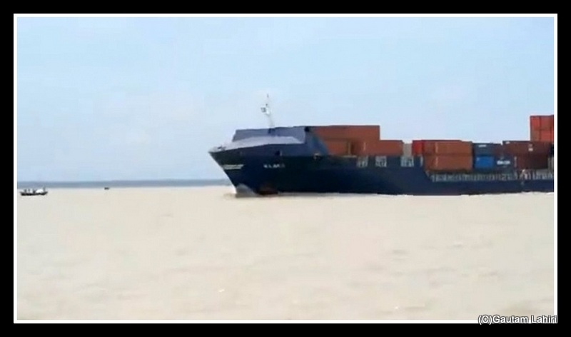 Passing ships through Hooghly river, West Bengal, India.