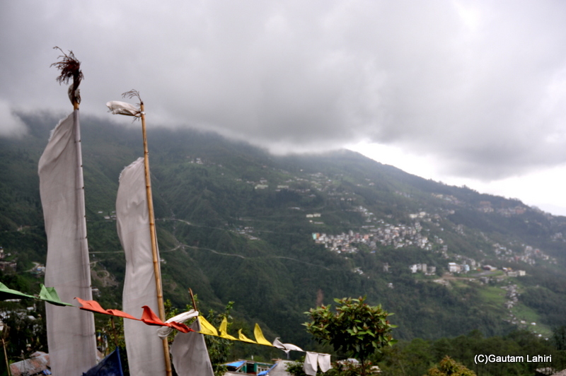 The white dotted houses clinging to the gentle slopes of Tashi viewpoint by gautam lahiri