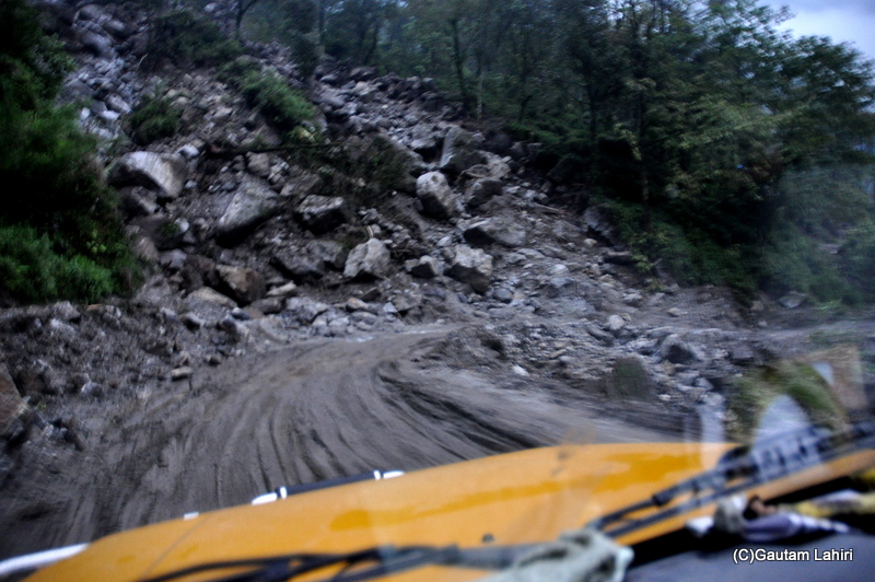 Evening ahead, under a light rain, the road becoming bad to worse; I drove the Sumo across multiple on no-road surface towards Tashi Viewpoint, Sikkim by gautam lahiri