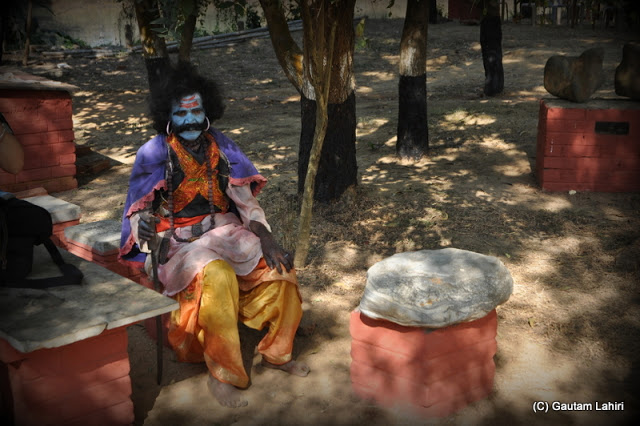 Mahishasura sitting below a tree to start his play  at Santiniketan, West Bengal, India by Gautam Lahiri