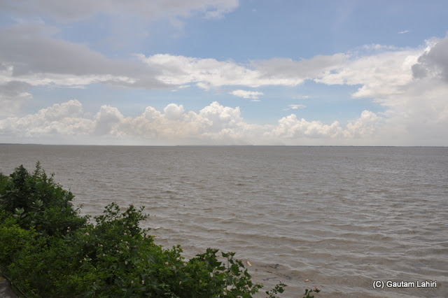 The massive, and broad ganges river flowing past Diamond Harbor, West Bengal, India by Gautam Lahiri