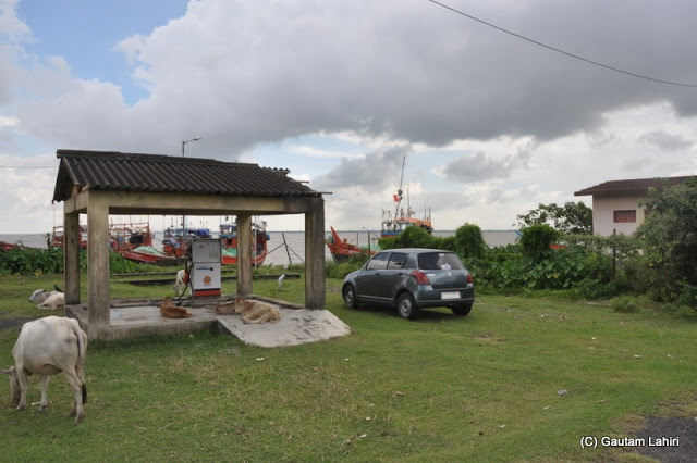Fishing boats moored around the village petrol pump where we had parked at Diamond Harbor, West Bengal, India by Gautam Lahiri