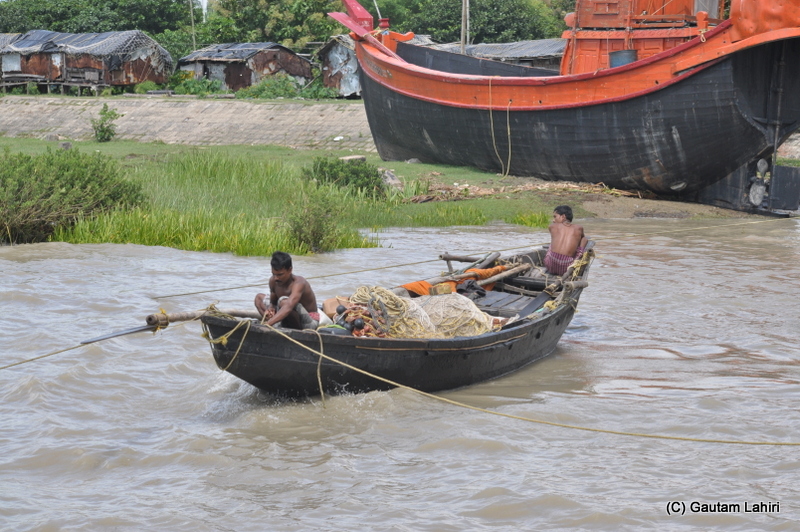 A large fishing boat sets off from the banks of river Ganges at Diamond Harbor, West Bengal, India by Gautam Lahiri