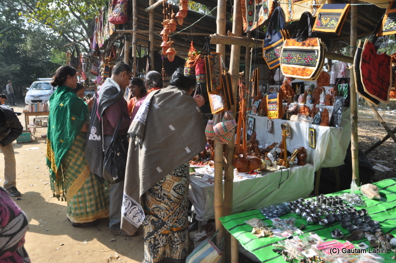 Buyers surround the handicraft stalls  at Santiniketan, West Bengal, India by Gautam Lahiri
