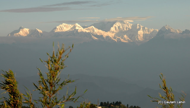 Every second the mountain changed its color.. it was gold, then was it crimson? or white. The clouds, the wind and all the forces of nature were playing around  at Darjeeling, West Bengal, India by Gautam Lahiri