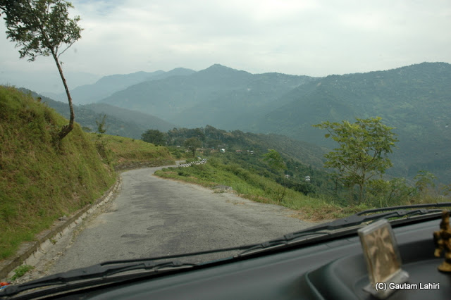 Road to Kalimpong, quite smooth over the hills snaking its way through the mountains  at Darjeeling, West Bengal, India by Gautam Lahiri