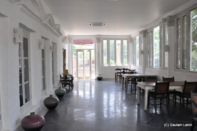 The white room perhaps used for extra guests can jolly well make a visitor have an ancient meal in peace at Bawali Rajbari, Kolkata, West Bengal, India by Gautam Lahiri