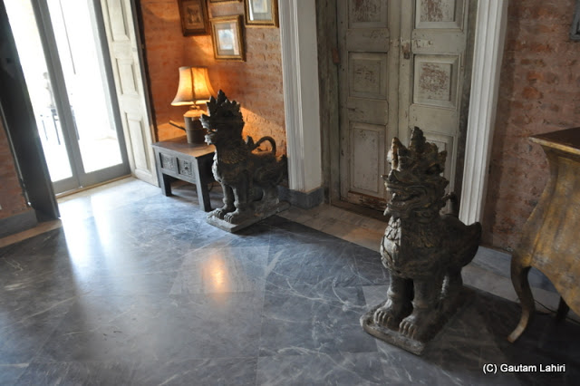 Metal dragons adorned the polished floors at Bawali Rajbari, Kolkata, West Bengal, India by Gautam Lahiri