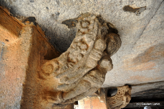 Intricately curved rock buttress holding the rock roof above, seen here ravaged by elements of nature but still strong enough and better engineered than today's marvels we see with computer-aided designs  at Bhubaneshwar, Odissa, India by Gautam Lahiri