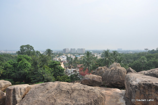 Squinted eyes trying to evade the sun rays, look at Bhubaneswar as we stood on Udayagiri  at Bhubaneshwar, Odissa, India by Gautam Lahiri