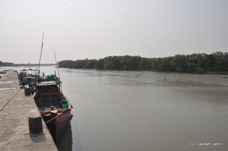 Fishing boat in Bay of Bengal at Frasergunj, Bakkhali beach, West Bengal, India near Bay of Bengal by Gautam Lahiri