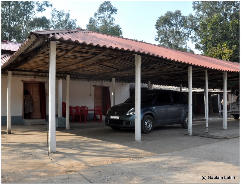 The living quarters and the car shade juxtaposed preventing the arduous effort of carrying luggage  at Joypur forest, Bankura by Gautam Lahiri