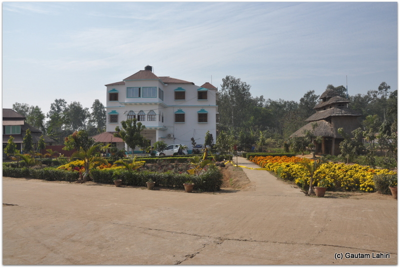 A flower laden walkway led us to a building where refreshments soothed us at Joypur forest, Bankura by Gautam Lahiri