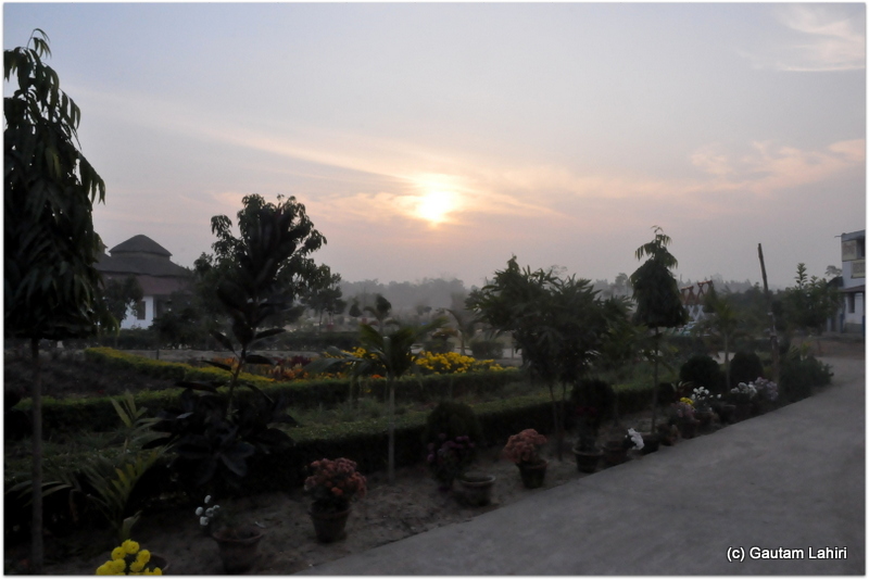 Eastern board lit up as the sullen sun peeped from within the golden clouds at Joypur forest, Bankua by Gautam Lahiri