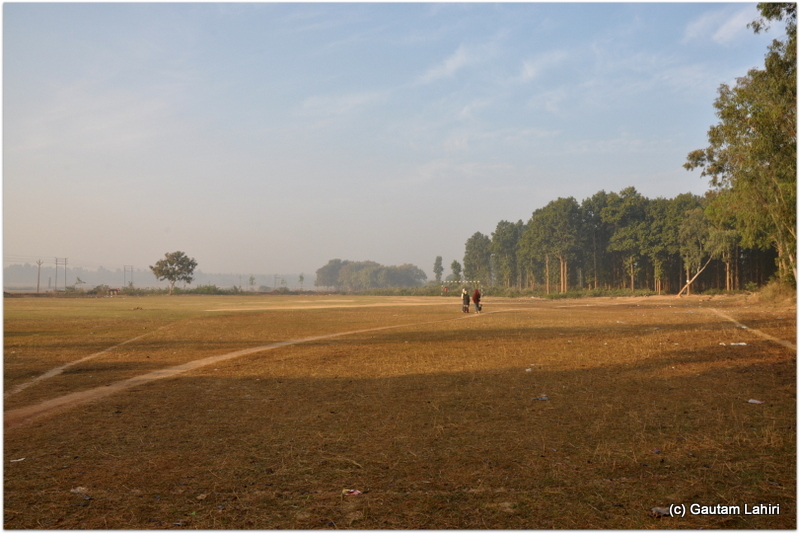 Football or a soccer field in the middle of a forest. Looked quite strange as it co-existed with dense forest on one side at Joypur forest, Bankura by Gautam Lahiri
