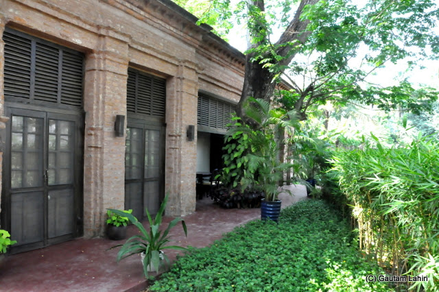 The outhouse in the garden among the trees at Bawali Rajbari, Kolkata, West Bengal, India by Gautam Lahiri
