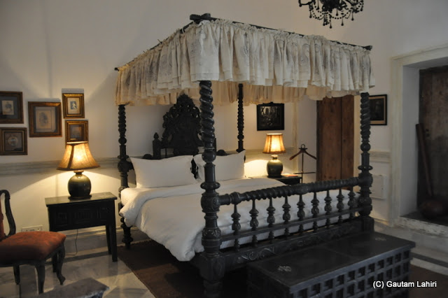 A four-poster bed, design which dates back to perhaps, 100-150 years back adorn one of the living rooms at Bawali Rajbari, Kolkata, West Bengal, India by Gautam Lahiri