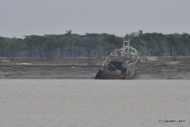 We captured this image of a big trawler, broken off in the middle while she was trying to carry cargo across the river. The wreckage was found moored on the Bangladesh bank of the Ichamati at Taki, West Bengal, India by Gautam Lahiri