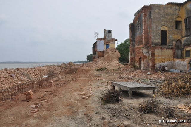 The broken residues of the zamindar's house looking at us with a taunting smile as we walked around at Taki, West Bengal, India by Gautam Lahiri