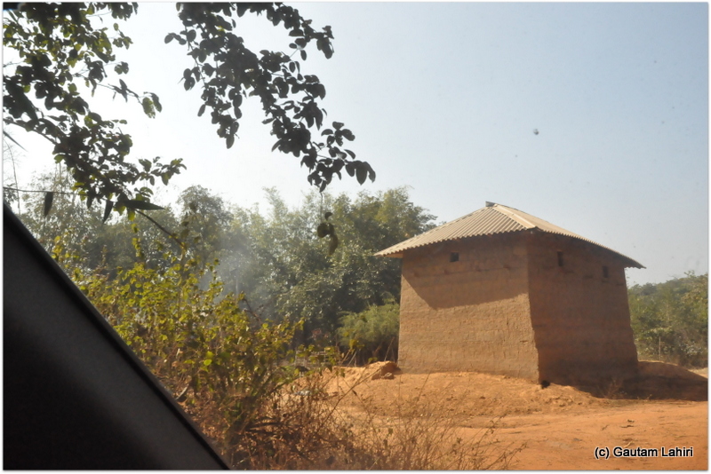A lone mud house was all that we could see among the dense jungle on Joypur jungle, Bankura by Gautam Lahiri