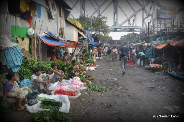 Flower sellers line up for the morning  at Kolkata, West Bengal, India by Gautam Lahiri