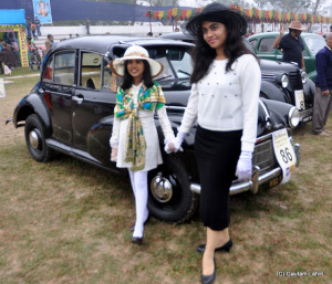 Excited and happy, dressed in European attire, young ladies proudly stand beside a 1946 Morris and 1946 Renault, one is an 800 cc, 4 cylinder engine standing beside 1003 cc, 4 cylinder beauty  at Kolkata, West Bengal, India by Gautam Lahiri